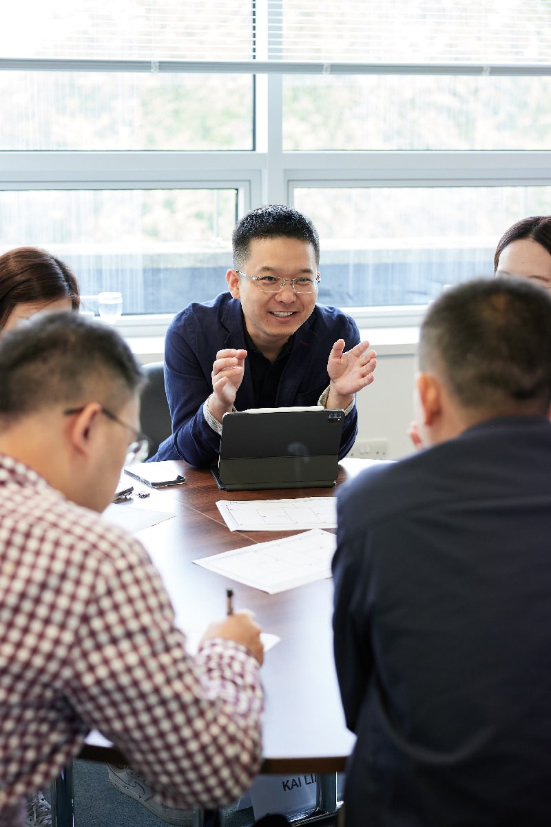 Group of learners in discussions around a table