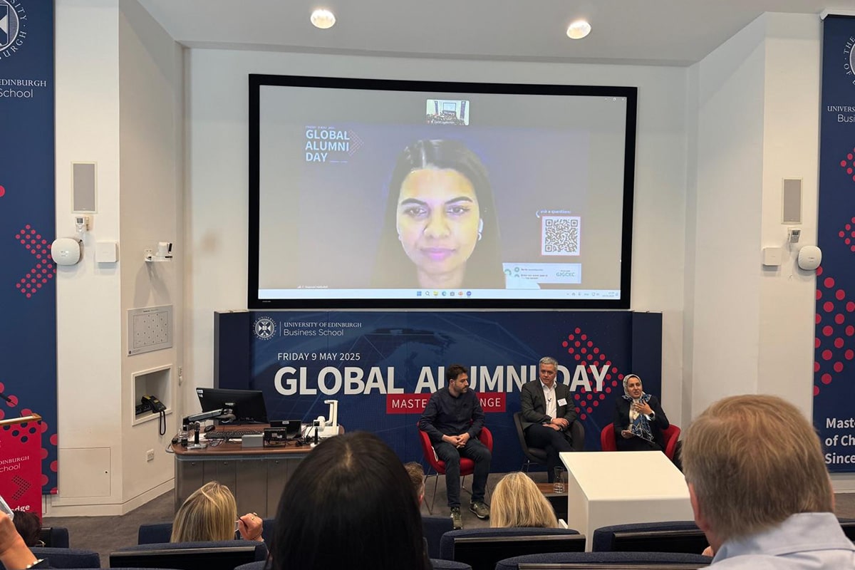 A panel discussion takes place in the Business School auditorium
