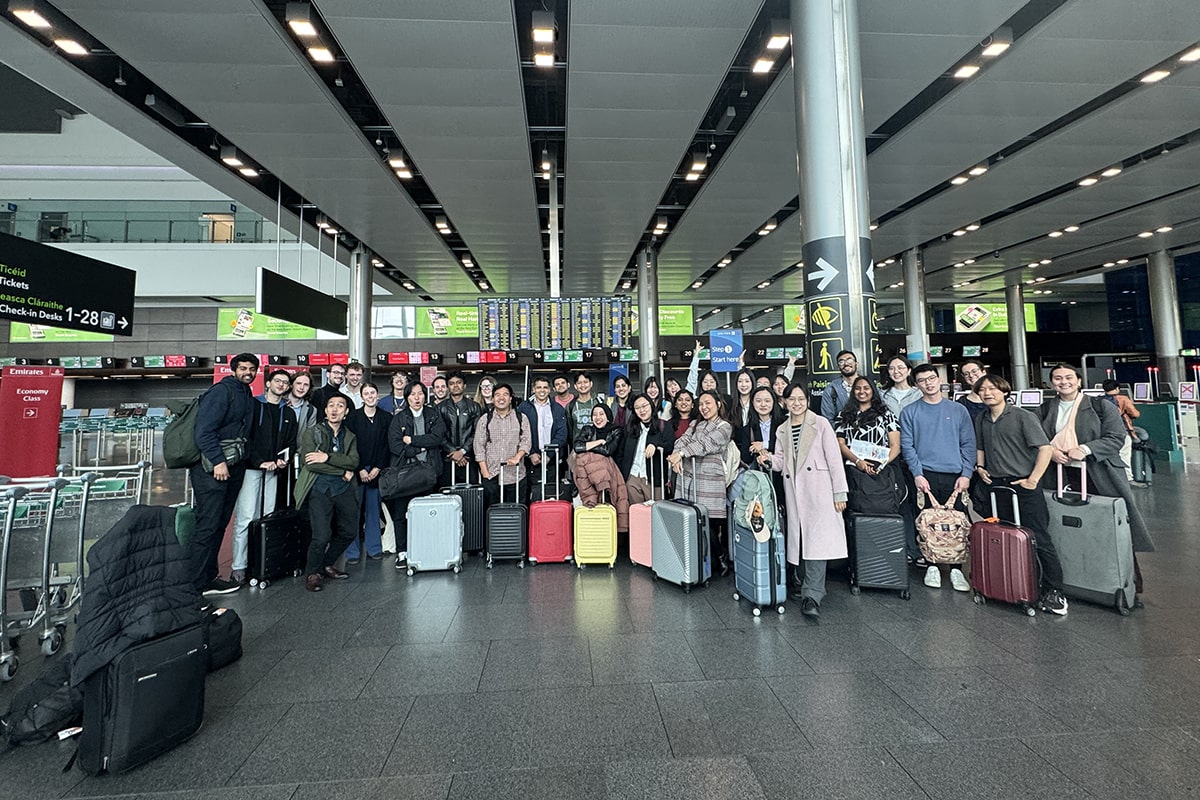 Large crowd of students with their luggage at airport
