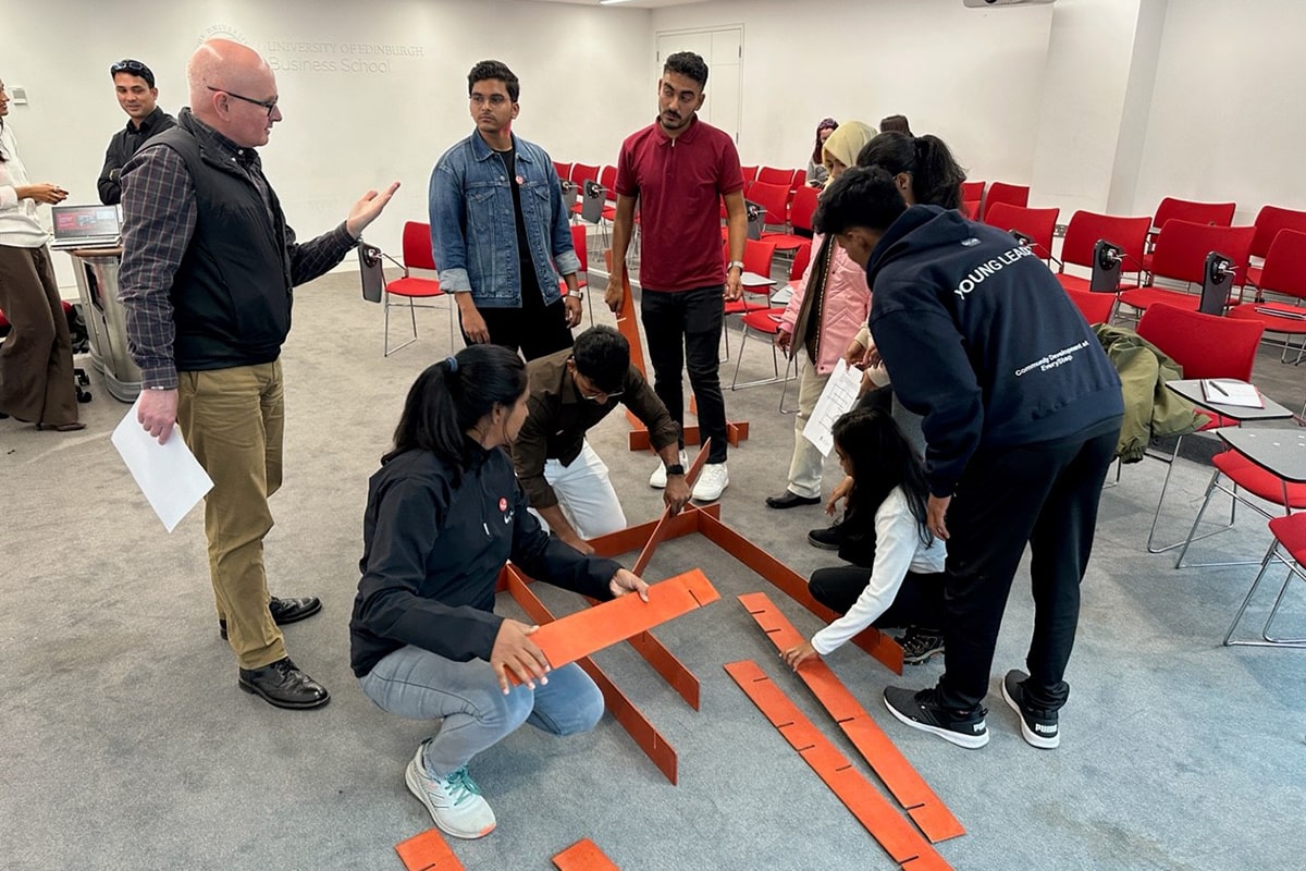 OSCAR Young Leaders demonstrating their skills with an experiential leadership and team development challenge, with Sandy Smith, UEBS