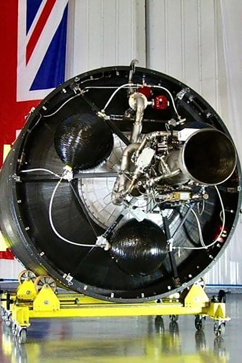 Skyrora rocket in warehouse with the British flag on the wall behind