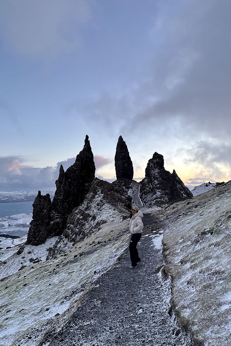 Student hiking the Old Man of Storr in Skye at sunset.