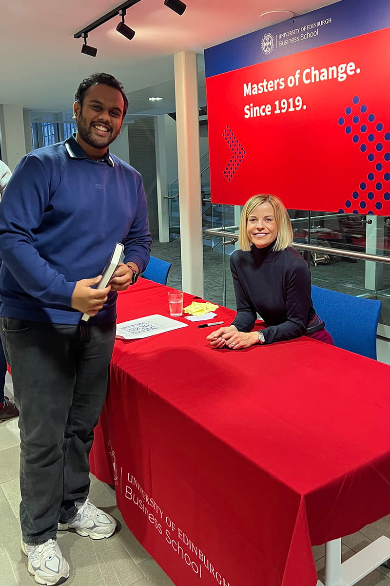 Sidhanth alongside Susie Wolff, Managing Director of the F1 Academy, during a book signing event at the University of Edinburgh Business School.