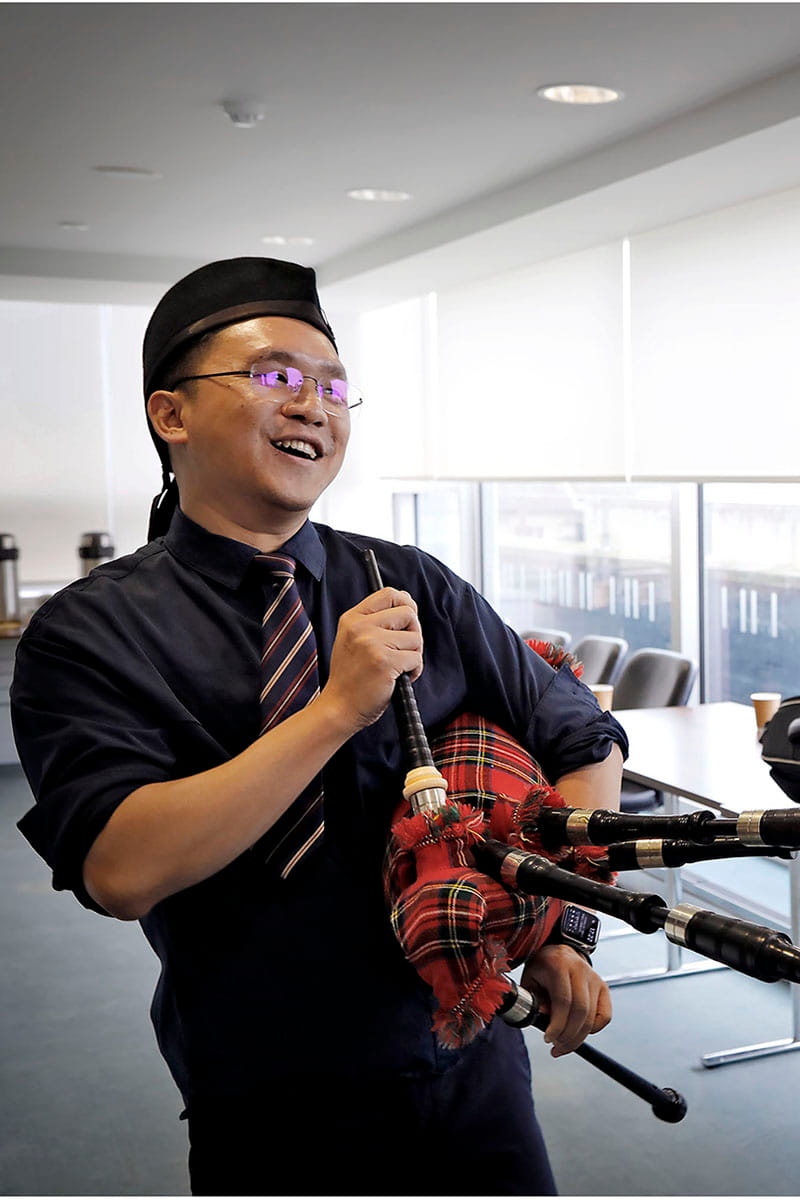 Man holding bagpipes