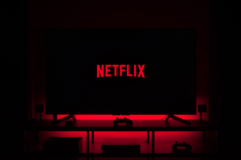 Strategic Change | Netflix logo on a tv screen in a dark room