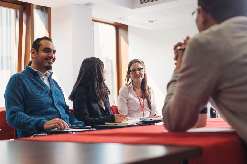 MSc E&I Option Courses - masters' students round a table