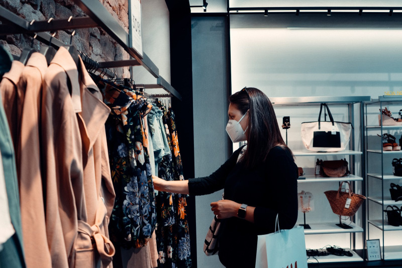Rethinking retail - woman shopping wearing a mask