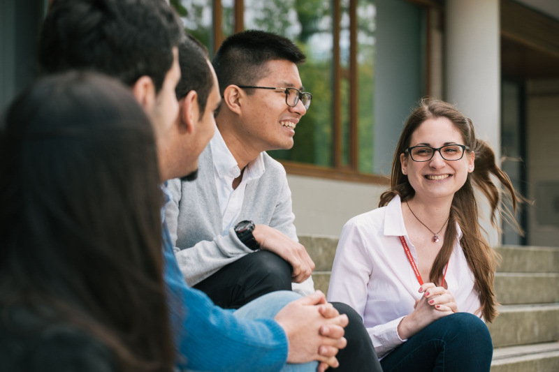 Steps to securing your offer at the Business School - students outside the School on George Square