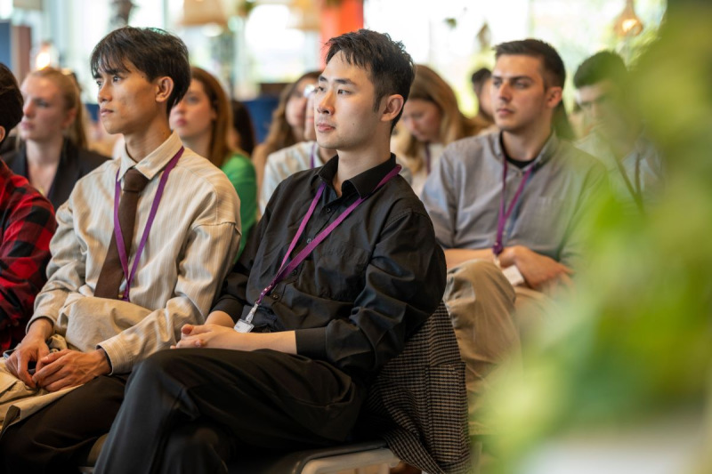 Students listening to a panel discussion
