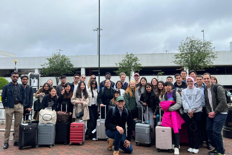 MSc Management Student Trek group gathered outside the airport with their luggage