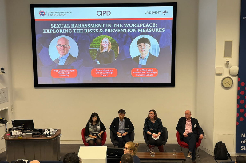 Four Panel members sat at the front of the auditorium