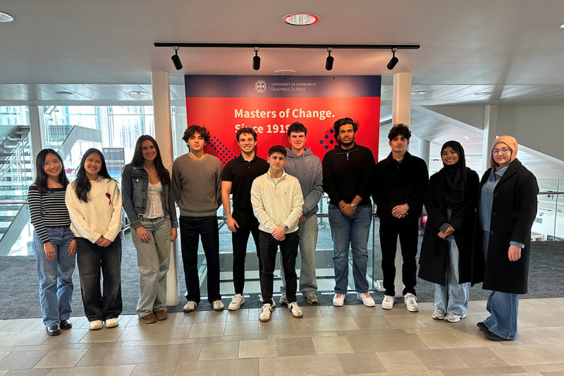 Students standing at the UEBS entrance