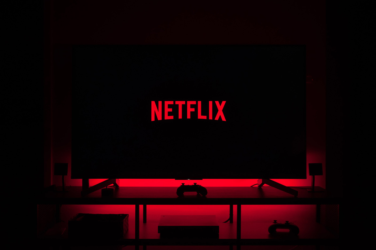 Strategic Change | Netflix logo on a tv screen in a dark room