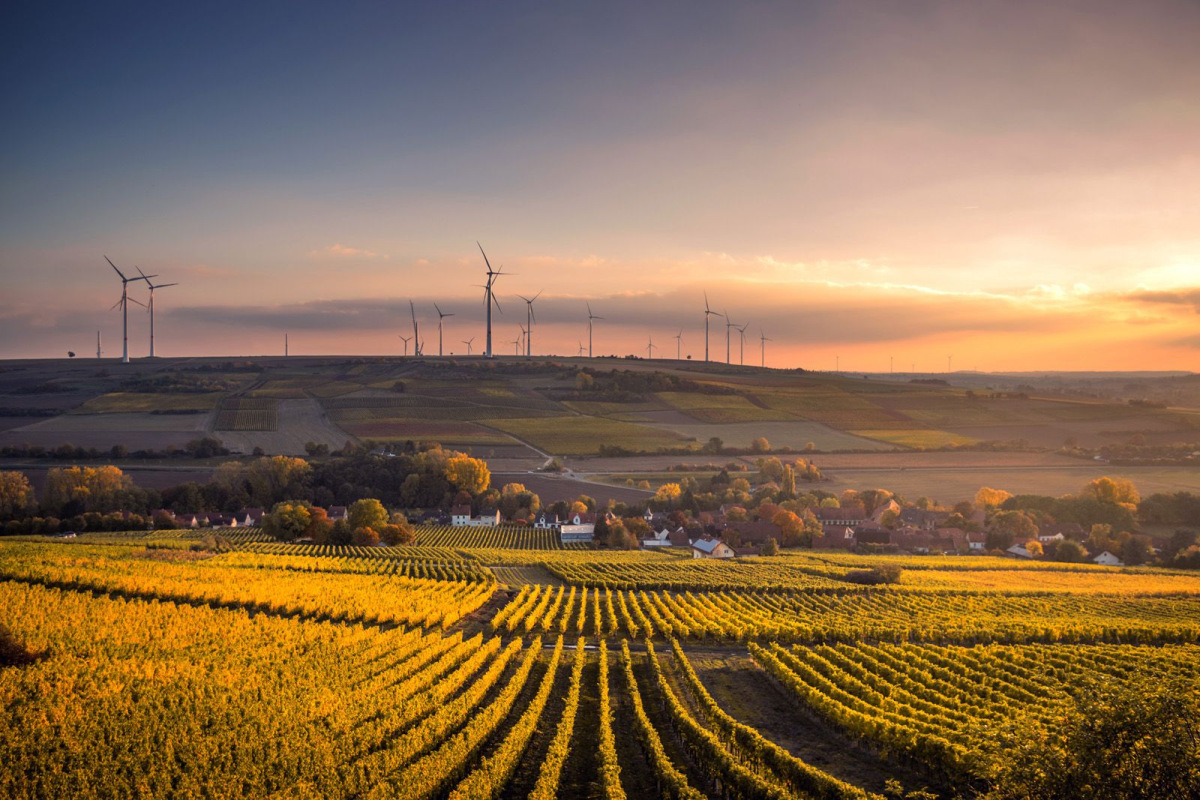 Windmills over fields at sunset; Karsten Würth