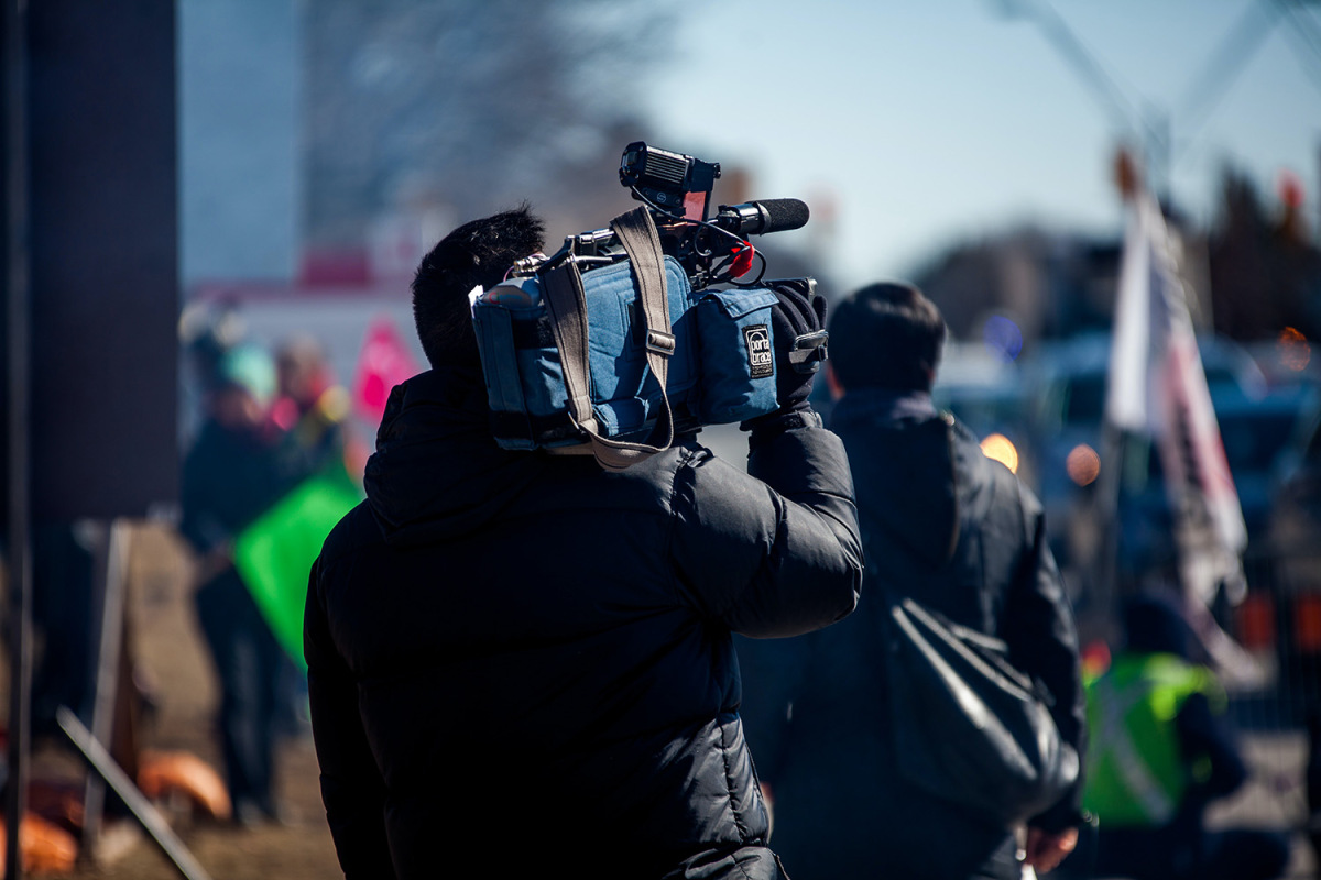 Cameraman capturing people on street