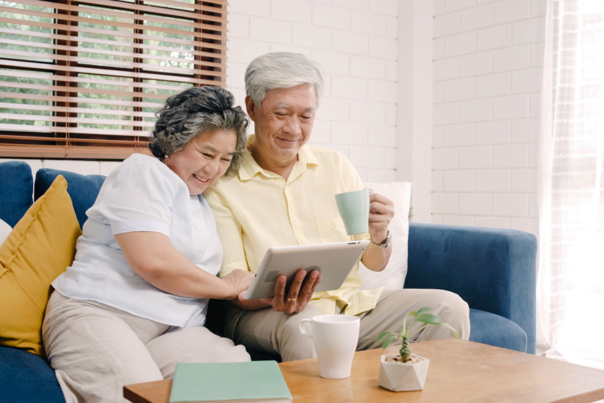 Older couple looking at tablet photo created by tirachardz