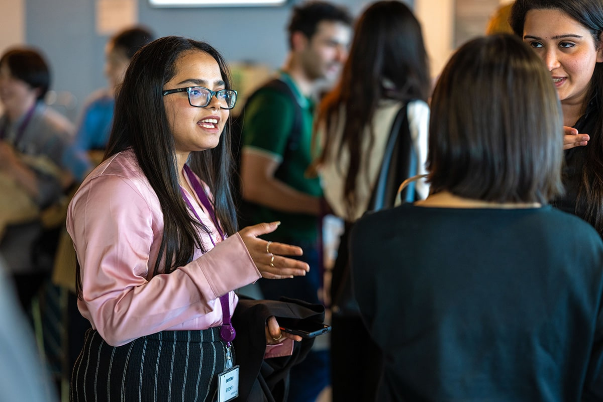 Student speaking to a group of people.