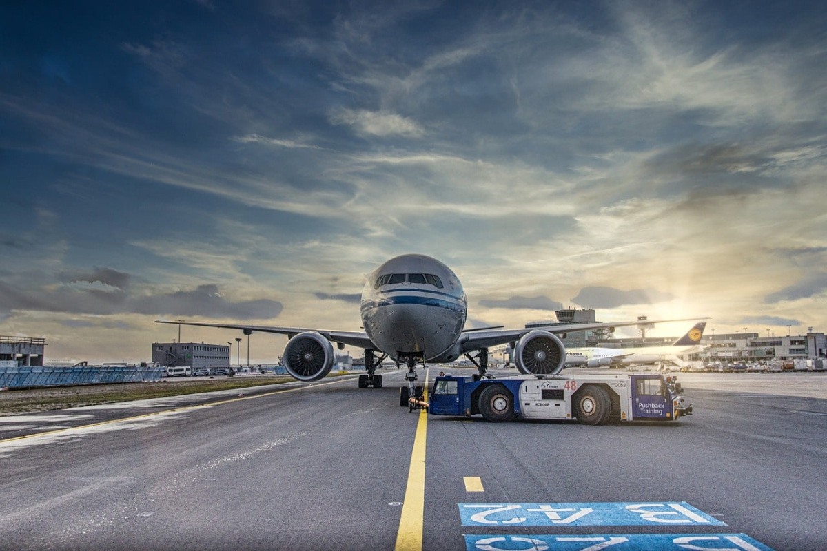 Photo of a stationary plane on a runway