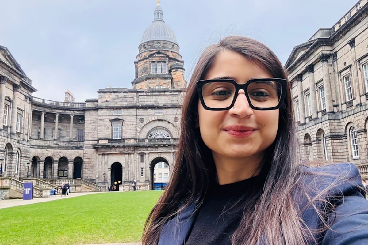 Pranshi standing in The Old College Quadrangle at the University of Edinburgh