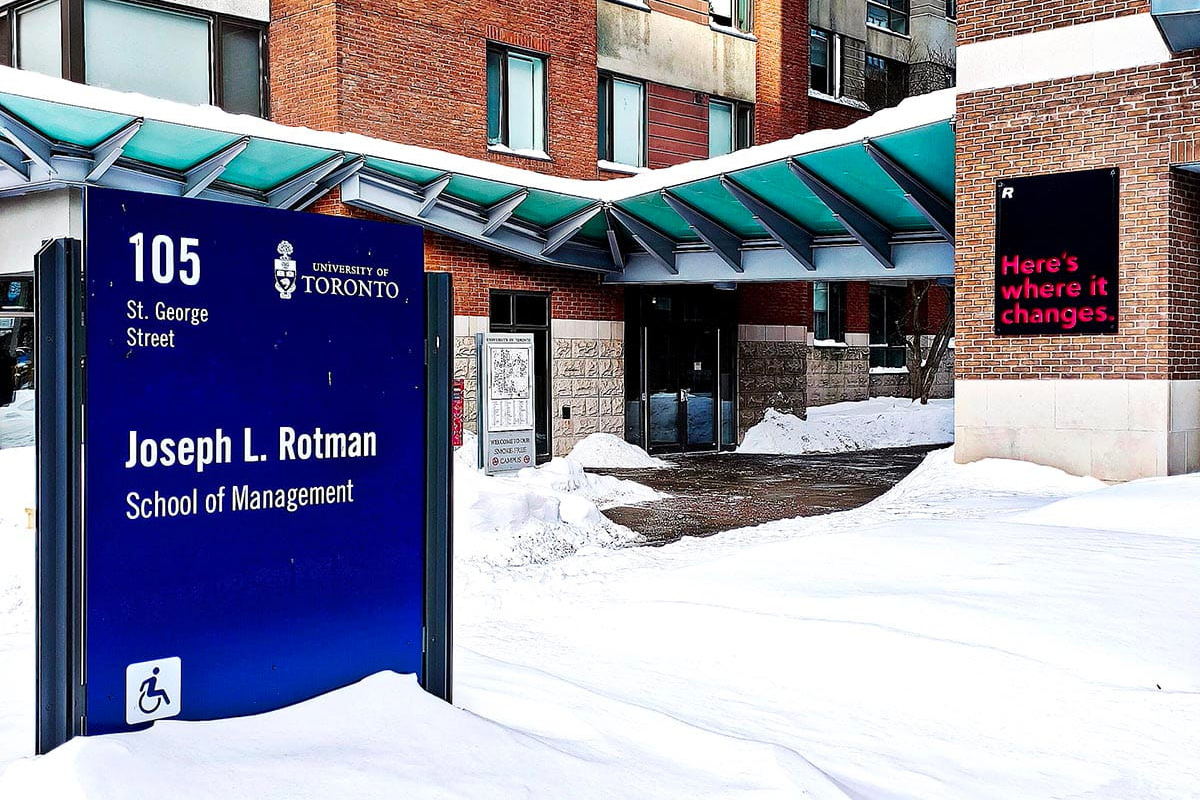 Photo of the outside of the Rotman School of Management building in the snow