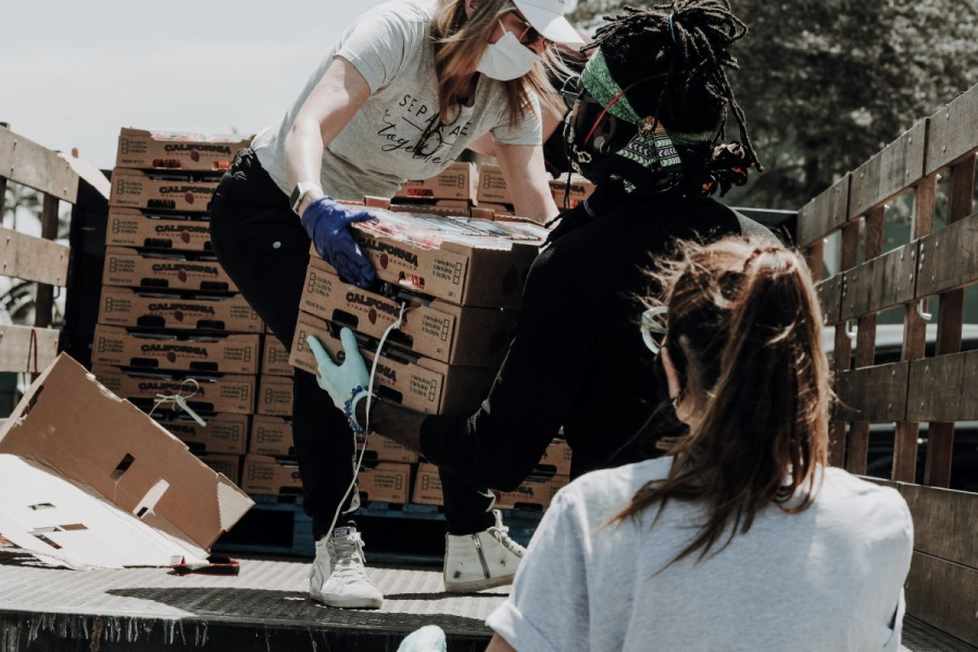 Aid boxes being unloaded from an aid truck