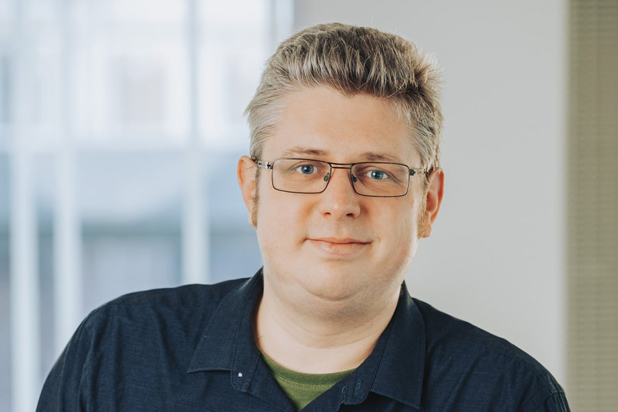 Headshot photograph of Tom